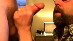 Bearded guy takes two loads to the face from his buddy